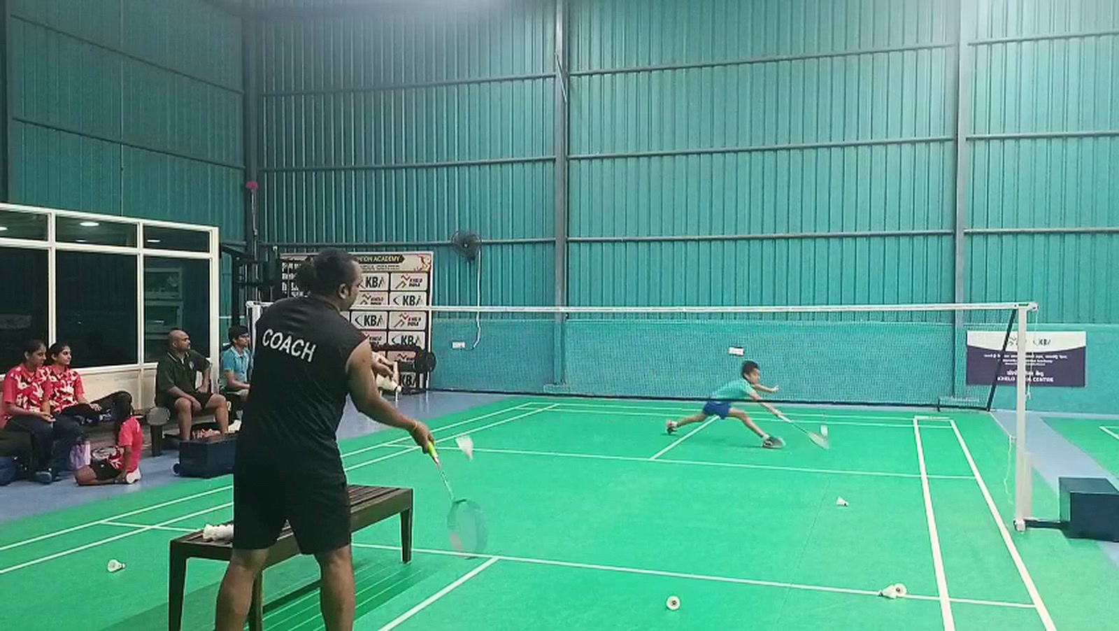 Indoor green synthetic badminton courts at Kamareddy Badminton Academy