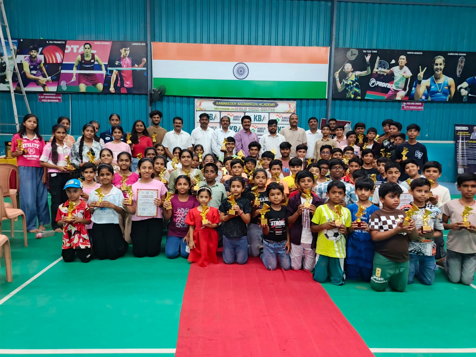 Prize distribution at a Kamareddy Badminton Academy tournament
